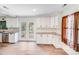 Modern kitchen with white cabinets, granite countertops, and stainless steel appliances at 4915 Huntington Farm Rd, Catawba, SC 29704