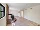 Spacious living room with white walls, wood floors, and a brick fireplace at 4915 Huntington Farm Rd, Catawba, SC 29704