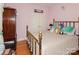 Cozy bedroom featuring a brass bed, wooden floors, and pale pink walls at 503 Kinsey Creek Ct, Rock Hill, SC 29730