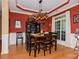 Elegant dining area with unique lighting fixture, large window, and classic decor at 503 Kinsey Creek Ct, Rock Hill, SC 29730