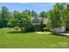 Charming home with lush front lawn, mature trees, and inviting front porch at 503 Kinsey Creek Ct, Rock Hill, SC 29730