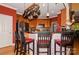Open kitchen features bar seating, stainless steel appliances, and brick accents at 503 Kinsey Creek Ct, Rock Hill, SC 29730