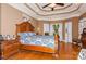 Primary bedroom with a tray ceiling and hardwood floors at 503 Kinsey Creek Ct, Rock Hill, SC 29730