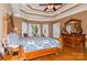 Spacious bedroom features a tray ceiling, hardwood floors, and natural light at 503 Kinsey Creek Ct, Rock Hill, SC 29730