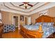 This main bedroom features a coffered ceiling, stylish decor, and a doorway to the ensuite bath at 503 Kinsey Creek Ct, Rock Hill, SC 29730