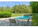 Private pool with mature trees and a white fence at 503 Kinsey Creek Ct, Rock Hill, SC 29730