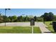 Outdoor basketball court with well-maintained green surroundings and clear signage of court rules at 5311 Courtfield Dr, Indian Trail, NC 28079