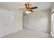 Bedroom featuring neutral walls, carpet, and white closet doors at 5311 Courtfield Dr, Indian Trail, NC 28079