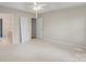 Bright and spacious bedroom featuring neutral walls and carpet at 5311 Courtfield Dr, Indian Trail, NC 28079