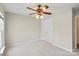 Bedroom featuring neutral walls, carpet, a ceiling fan, and a white closet door at 5311 Courtfield Dr, Indian Trail, NC 28079