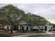 Charming clubhouse exterior framed by mature trees and manicured landscaping at 5311 Courtfield Dr, Indian Trail, NC 28079