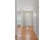 Bright foyer with hardwood floors, column accents and a view of the front windows at 5311 Courtfield Dr, Indian Trail, NC 28079