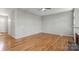 Spacious living room features hardwood floors, neutral walls, and ample natural light at 5311 Courtfield Dr, Indian Trail, NC 28079