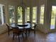 Bright dining area with large windows and a decorative orb chandelier at 5517 Mountain Point Ln, Charlotte, NC 28216