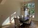 Bright dining room with wood floors, decorative chandelier and natural light with a view of outdoors at 5517 Mountain Point Ln, Charlotte, NC 28216