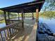 A tranquil view from a wooden dock, perfect for enjoying the waterfront at 5517 Mountain Point Ln, Charlotte, NC 28216