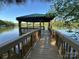 Waterfront property featuring a private covered boat dock offering serene views and outdoor enjoyment at 5517 Mountain Point Ln, Charlotte, NC 28216