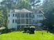 Multi-story home with balconies, a fenced yard, and beautiful landscaping for outdoor enjoyment at 5517 Mountain Point Ln, Charlotte, NC 28216