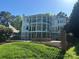 Multi-story home with balconies, a fenced yard, and beautiful landscaping for outdoor enjoyment at 5517 Mountain Point Ln, Charlotte, NC 28216