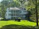 Multi-story home with balconies, a fenced yard, and beautiful landscaping for outdoor enjoyment at 5517 Mountain Point Ln, Charlotte, NC 28216