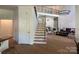 Inviting open-concept living space with a staircase and views of the living area at 5517 Mountain Point Ln, Charlotte, NC 28216