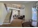 Open-concept living area with stairs, great room, and abundant natural light at 5517 Mountain Point Ln, Charlotte, NC 28216