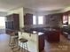 Kitchen with bar seating, stainless steel appliances, and custom cabinetry at 5517 Mountain Point Ln, Charlotte, NC 28216