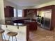 Gourmet kitchen with stainless steel appliances, granite countertops, and custom cabinetry at 5517 Mountain Point Ln, Charlotte, NC 28216