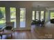 Bright, airy living room with an adjacent lake view and dining space at 5517 Mountain Point Ln, Charlotte, NC 28216