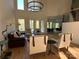 Bright living room with wood floors, high ceilings, multiple windows with a view of the outdoors at 5517 Mountain Point Ln, Charlotte, NC 28216