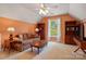 Cozy bedroom with sloped ceiling, built-in bookshelves, and comfortable seating area at 6009 Glen Manor Dr, Charlotte, NC 28269