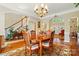 Inviting dining room with hardwood floors, natural light, chandelier and open floor plan at 6009 Glen Manor Dr, Charlotte, NC 28269