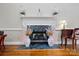 Elegant fireplace with marble hearth, white mantle, and decorative floral arrangements in a light and airy room at 6009 Glen Manor Dr, Charlotte, NC 28269