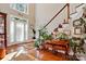 Warm foyer boasts hardwood floors, staircase, and a charming entryway table at 6009 Glen Manor Dr, Charlotte, NC 28269