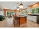 Spacious eat-in kitchen with an island, natural light, and an open floor plan at 6009 Glen Manor Dr, Charlotte, NC 28269