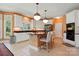 Well-equipped kitchen featuring an island with seating, stainless-steel appliances, and ample storage at 6009 Glen Manor Dr, Charlotte, NC 28269