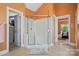 This spacious bathroom includes a walk-in shower with glass doors and tile surround at 6009 Glen Manor Dr, Charlotte, NC 28269