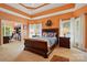 Spacious main bedroom with trey ceilings, large windows, and a view to the office at 6009 Glen Manor Dr, Charlotte, NC 28269