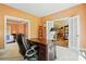 Well-lit office with french doors, desk, and access to dining room and bedroom at 6009 Glen Manor Dr, Charlotte, NC 28269
