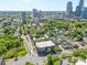 Aerial view of urban landscape, green spaces, buildings, and parking at 626 N Graham St # 405, Charlotte, NC 28202