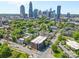 Stunning aerial view of a neighborhood near downtown with lush greenery and a glimpse of the city skyline at 626 N Graham St # 405, Charlotte, NC 28202