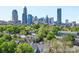 The skyline rises behind the neighborhood trees at 626 N Graham St # 405, Charlotte, NC 28202
