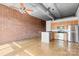 Modern kitchen featuring stainless steel appliances, sleek cabinetry, and an open layout with exposed brick at 626 N Graham St # 405, Charlotte, NC 28202