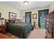 A bedroom featuring carpet, natural light from windows, furniture and green walls at 6420 Saint John Ln, Charlotte, NC 28210
