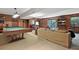 Comfortable game room with billiard table, cozy seating, wood paneling and sliding glass doors at 6420 Saint John Ln, Charlotte, NC 28210