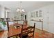 Well-lit kitchen with white cabinets, black countertops, and hardwood floors at 6420 Saint John Ln, Charlotte, NC 28210