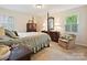 Comfortable main bedroom featuring carpet, natural light from windows and furniture at 6420 Saint John Ln, Charlotte, NC 28210