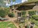 Brick patio featuring outdoor seating, a dining area, mature landscaping, and a grill at 6420 Saint John Ln, Charlotte, NC 28210