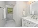 Clean bathroom featuring modern vanity, bright lighting, and a shower with white curtain at 6634 Rocky Falls Rd, Charlotte, NC 28211
