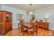 Formal dining room with hardwood floors, chandelier, and classic furnishings at 6634 Rocky Falls Rd, Charlotte, NC 28211
